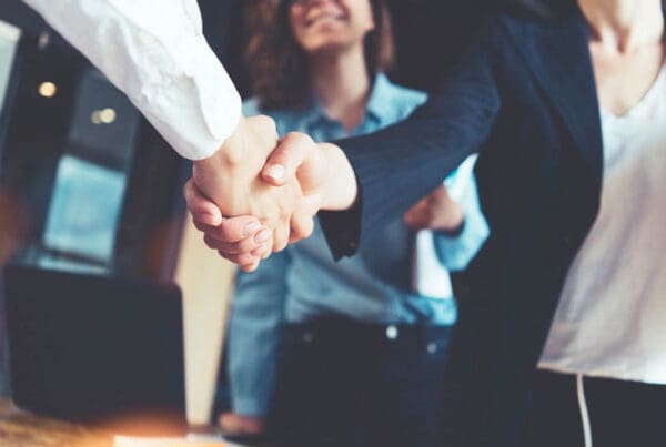 Insurance Agents & Brokers - Strong Handshake with Colleagues